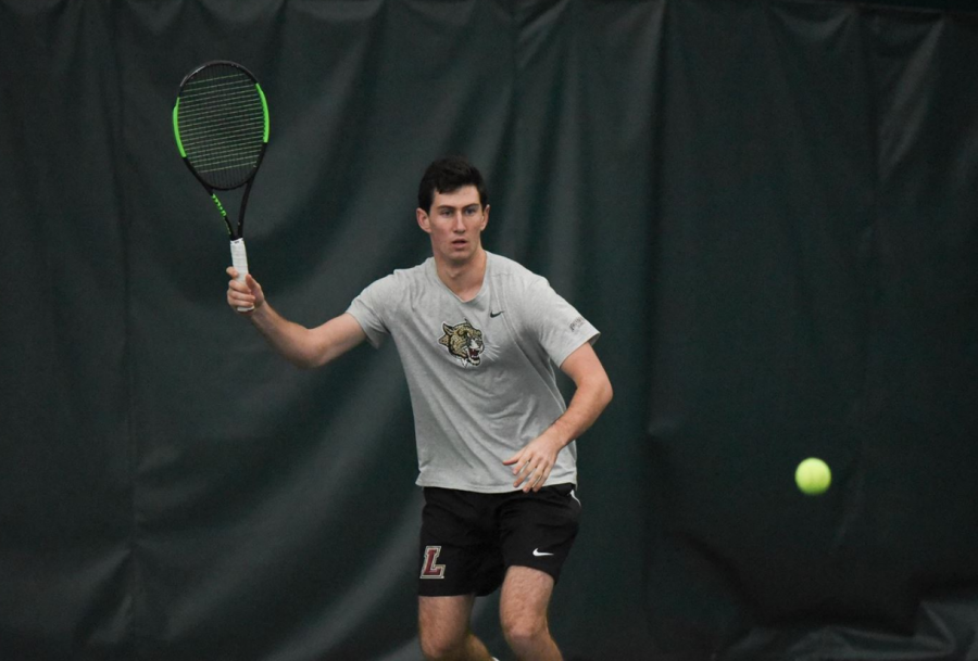Lafayette College freshman Josh Wolfe prepares to hit the tennis ball during a morning match against St. Francis College on Feb. 9.