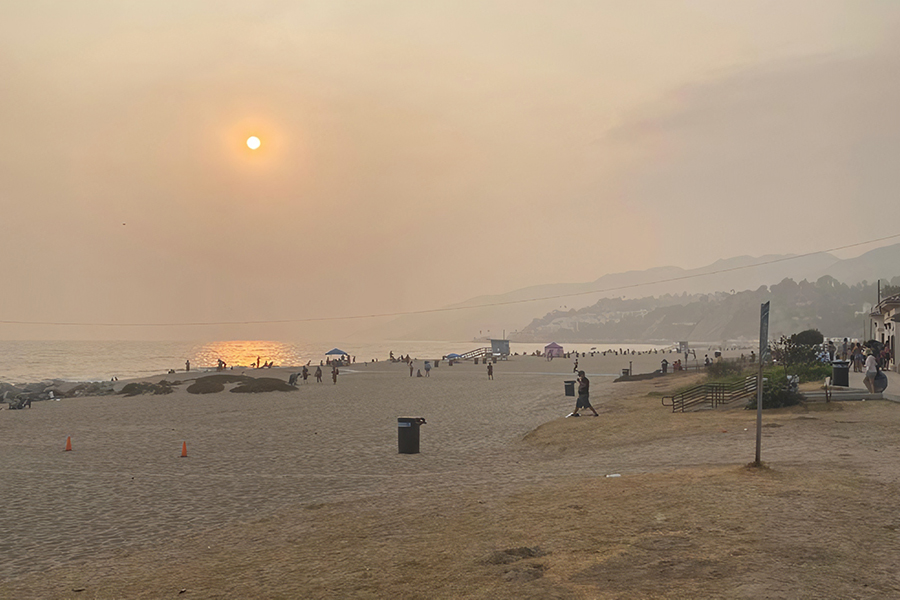 AIR: Smoke from fires as that ravaged the West Coast filled the skies Sept. 13, shrouding the sun at Will Rogers State Beach in the Pacific Palisades. The nearest fire was the Bobcat Fire in Pasadena.
