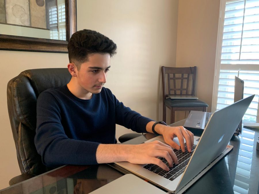 Preparing+to+execute+another+deal%2C+junior+Kayvon+Rezaei+examines+his+stock+market+portfolio.+Rezaei+has+been+trading+stocks+for+over+a+year+and+spends+time+after+school+every+day+analyzing+graphs+and+making+trades.+%E2%80%9CThe+best+part+about+doing+the+stock+market+for+me+is+when+you+work+hard+and+earn+the+money%2C%E2%80%9D+Rezaei+said.+
