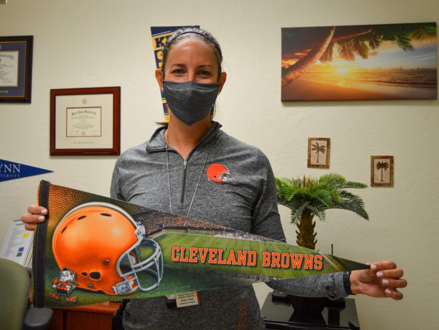 Assistant+Principal+Kelly+Foss+proudly+displays+her+Cleveland+Browns+pennant%2C+shirt+and+watch+band+on+Jan.+11+after+the+Browns+defeated+the+Steelers+on+Jan.+10.
