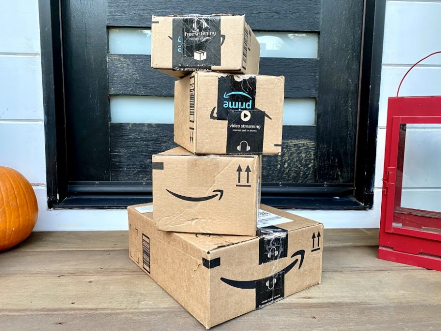A+stack+of+Amazon+boxes+on+the+front+porch+of+a+home.+