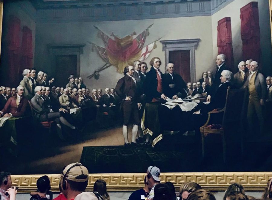 Visitors+at+the+capitol+building+observe+a+painting+of+the+Constitutional+Convention%2C+where+the+Founding+Fathers+used+negotiations+to+form+our+nation.