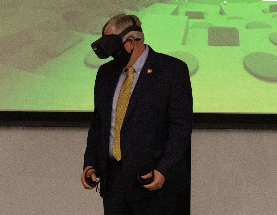 Governor+Mike+Parson+visited+the+Lee+Summit+Missouri+Innovation+Campus+on+March+2.+Jeff+Danley+from+VMLY%26R+led+Parson+through+a+presentation+of+the+virtual+reality+demonstration.+I+enjoy+bringing+in+people+into+virtual+reality+to+help+introduce+them+to+new+experiences+and+show+what+the+possibilities+are+for+virtual+reality%2C+Danley+said.+With+the+governor%2C+hopefully+it+helped+him+understand+how+we+can+use+virtual+reality+in+a+classroom+environment+and+how+that%E2%80%99s+going+to+better+prepare+students+here+at+UCM+for+the+future+workforce.