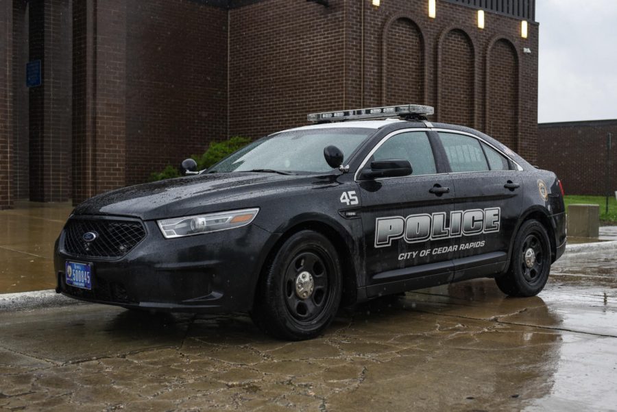 The Cedar Rapids Police Department's car parked outside of Kennedy High School.