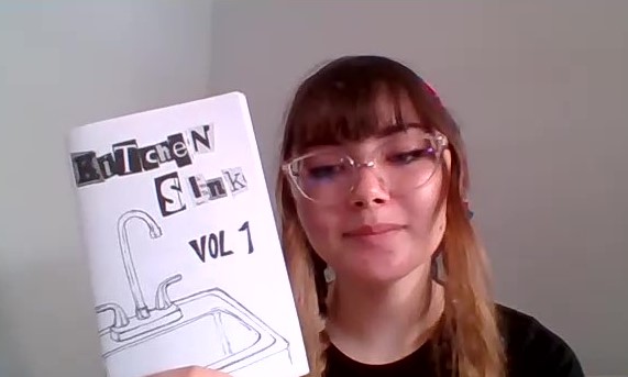 Emma Schlossman holding volume one of the Kitchen Sink Zine, a zine she and Misha Hashemi published. [This] zine has a lot to do with identity, personal experiences, and self-expression, Schlossman says. Photo taken on September 15. Safia Ahmed/The Union