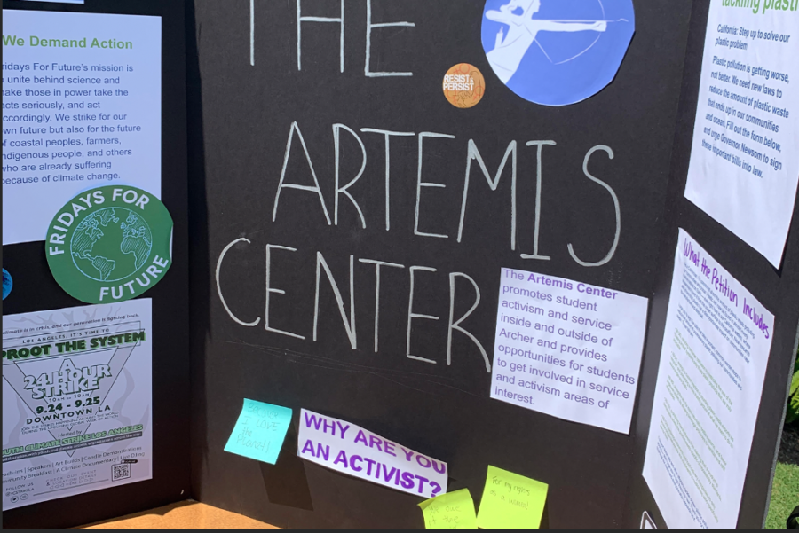 Student leaders of The Artemis Center set up a poster board during the club fair, informing the community on opportunities to engage with service. This year, as the club fair coincided with the Los Angeles climate strike, the Artemis center provided students with information about the strike happening that same day and encouraged students to sign a petition for California plastic laws. 
