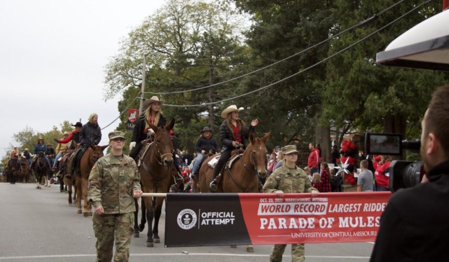 Mule Riders Victoria Happy and Holly Hagood lead the world record-attempt during the
homecoming parade. In order to qualify, the attempt had to be recorded.
