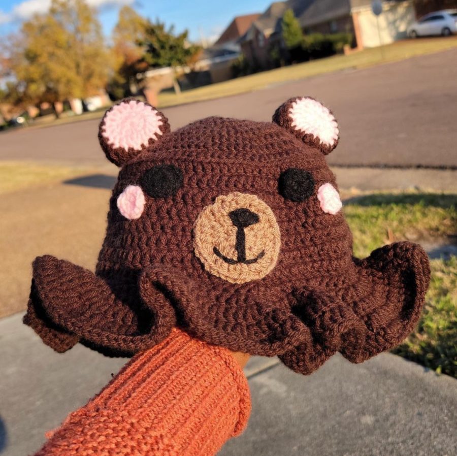 Shakira Townsend (11) shows off one of her many crochet projects, a handmade bear bucket hat. Townsend was persuaded by her friends to make a business out of her crochet hobby, which she promotes on Instagram.