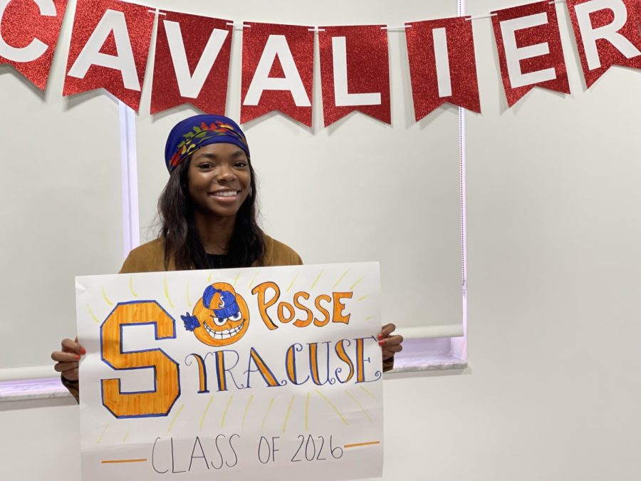 Briell+Robinson+proudly+holds+her+Syracuse+poster+as+she+gets+ready+to+embark+on+a+new+academic+journey.