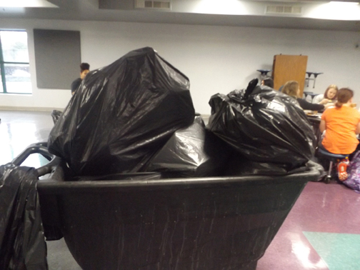 TAKING OUT THE TRASH. Several black trash bags full of
trash and food waste are collected and removed each day.
The cafeteria experiences serious food waste due to short lunch times, picky eating habits, and COVID-19.