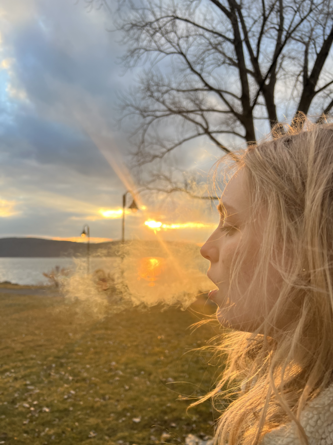 A woman at the Dobbs Ferry waterfront smokes marijuana as a result of the recent legalization of recreational cannabis. While marijuana is legal and decriminalized for all adults 21 or older in New York State, Dobbs Ferry opted to not allow any dispensaries or lounges in the town.