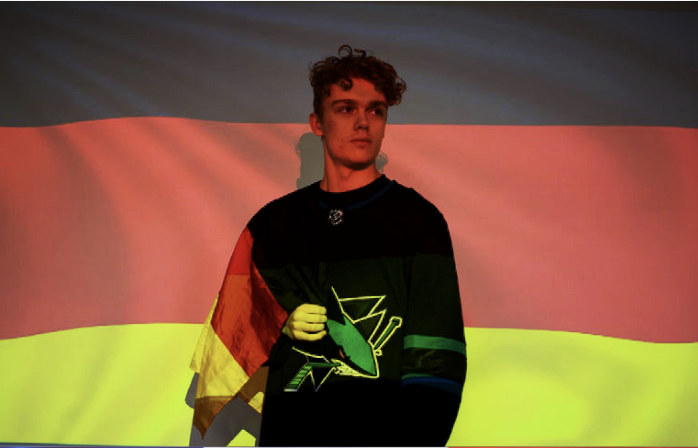 Senior+Matvey+Jennsen+poses+proudly+in+front+of+the+German+flag.