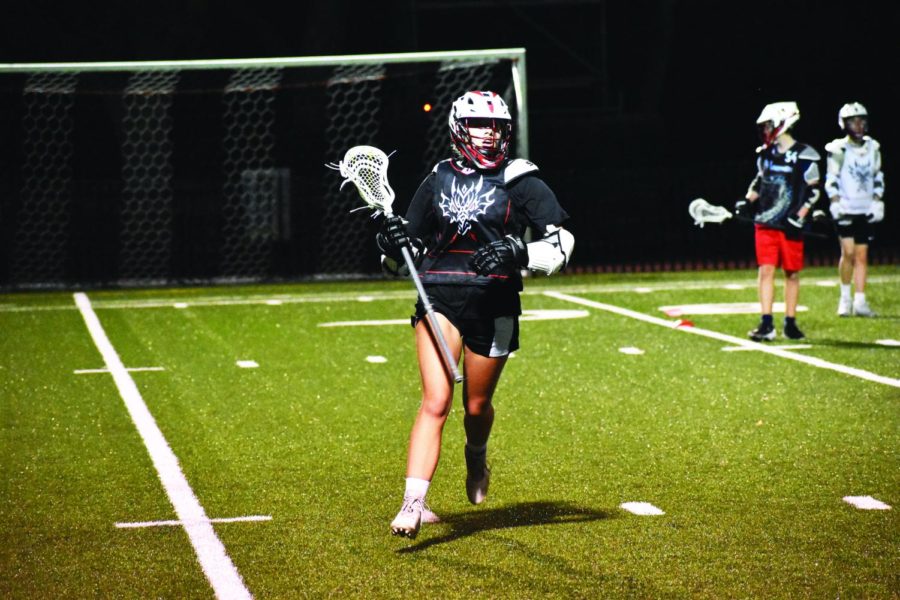 CHECK THE PATRIARCHY: In a ball control drill, Prentiss Corbin ’22 trains for season opener versus Brentwood High School on Feb. 22.