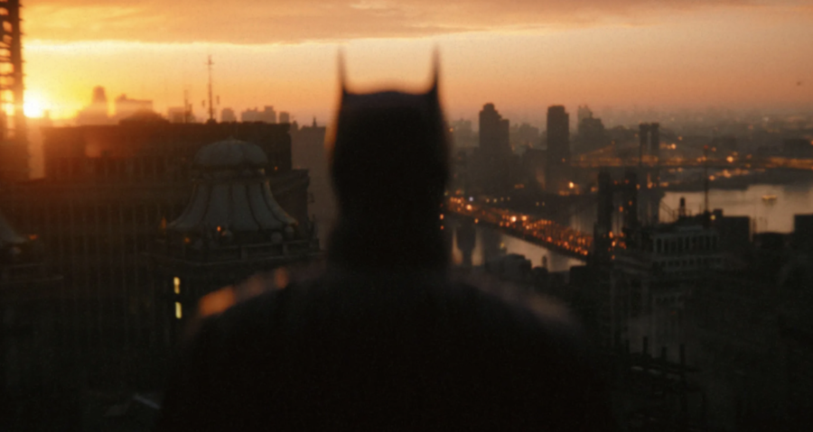 Batman+%28Robert+Pattinson%29+looks+out+across+the+Gotham+skyline+in+The+Batman.+The+film%2C+directed+by+Matt+Reeves%2C+is+now+playing+in+theaters.