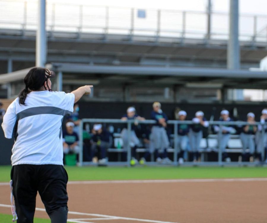 Coach+Coleman+coaches+from+the+sidelines.+She+has+been+a+softball+coach+for+24+years.