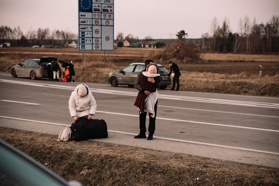 Ukrainian refugees pack their luggage on the Poland-Ukraine border. Surrounding countries and even the U.S. have seen an influx of Ukrainian refugees.