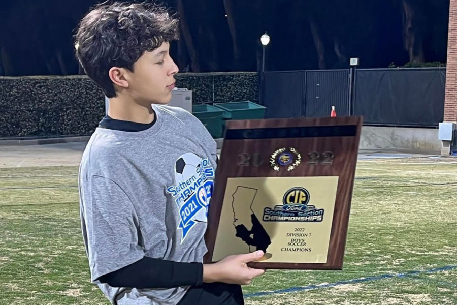 Goalie Arjuna Thiagarjan poses with his Division 7 CIF championship plaque. He believes sports psychologists are beneficial in unpacking the harmful effects of an unattainable standard of perfectionism athletes are held to. I do not get as much sleep as I should, so I am usually very, very tired during school. Thiagarajan said.  As an athlete, I have to have very good grades to play and when I do play [especially as goalie], my games have to be perfect.