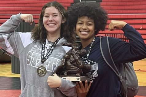 Sage Benca (left) and Selena Sifuentes Shaffer celebrate after the Vista Ridge Invitational tournament. Benca and Sifuentes Shaffer, team captains and best friends, have made a significant impact on the Ranger wrestling program.