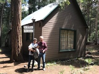Principal donors Franklin and Sandra Yee stand outside the beloved cabin Sandras father bought in 1953.