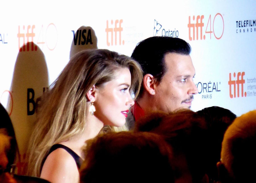 Amber Heard accompanies Johnny Depp to the Black Mass premiere while they were married.