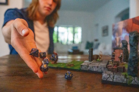 Dungeon Master Joe Bremer rolls the dice he uses to run his game of Dungeons and Dragons. 