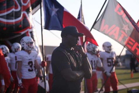 Coppell coach Antonio Wiley gets ready for the Coppell football game against Keller Timber Creek at Keller ISD Athletic Complex on Sep. 9. Wiley leads the team by building a foundation of trust and respect. Photo by Olivia Short.
