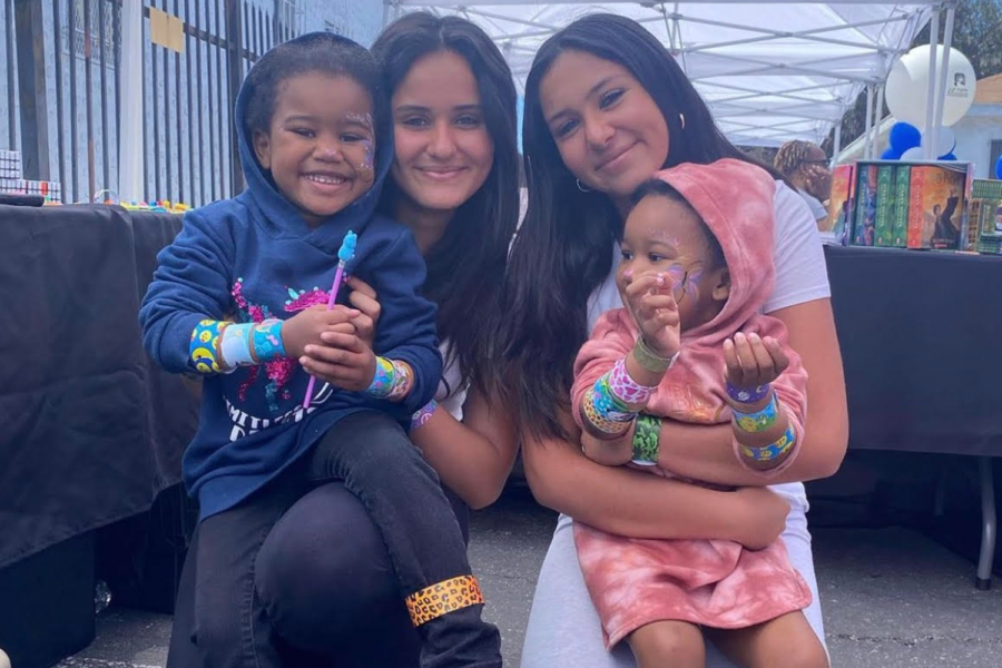 Sisters and founders of non-profit organization, Coco's Angels, hold foster youth at their annual Back to School event. Delara and Layla Tehranchi organize events to connect with foster children and provide them with resources they have gathered through drives.