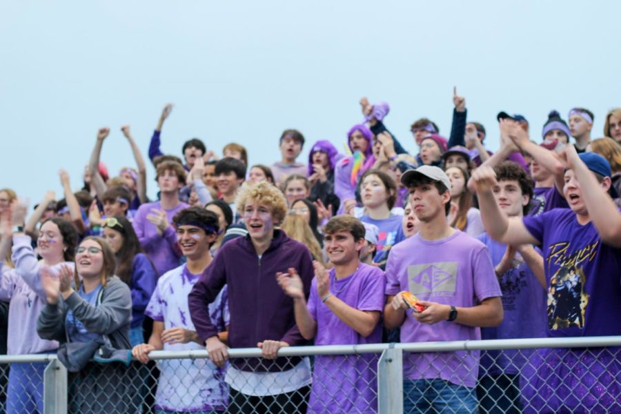 On+October+25%2C+the+Presque+Isle+student+section+flexes+their+purple+at+the+girls+varsity+quarterfinal.+%E2%80%9CIt+was+really+great+to+support+Rhiauna+and+the+Marstons+and+it+was+a+lot+of+fun+to+see+how+people+dressed+up%2C+Wyatt+Young+24+said.+I+liked+that+we+all+had+face+paint%2C+even+though+it+was+purple.+It+was+a+good+change+going+from+blue+to+purple.%E2%80%9D