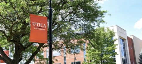 Courtesy of Utica University website, depicting an orange sign with the name.