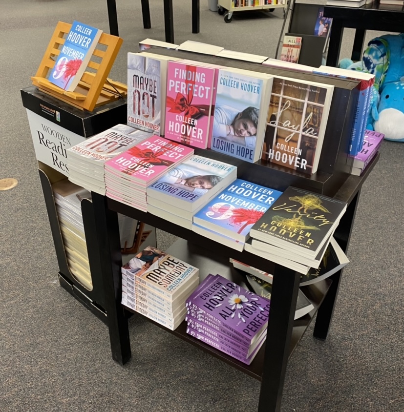 The reemergence of reading is apparent in bookstores as entire tables have become dedicated to %23Booktok and in this photo specifically, Colleen Hoover.