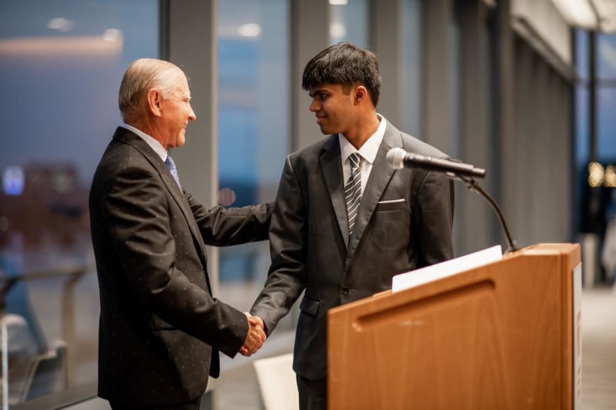 Davidson Institute Co-Founder Bob Davidson congratulates Arjun 
Barrett (12) on receiving a Davidson Fellows award at the MIT campus on Sept. 10. “Its less about the fact that its an award and more about the validation that [my project] is actually meaningful and has contributed in some small way to some field of technology,” Arjun said. “And thats something that I really strive to do just in general. So thats kind of why I find it super rewarding.”