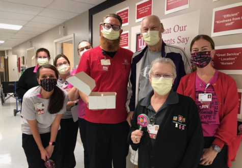 Bill Johnson poses with the doctors and nurses who threw him a celebration after helping him during 
his time at IU Health 
Oncology Bedford.