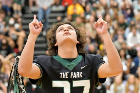 Junior Hunter Keelen celebrates being crowned homecoming prince during the pep rally on Oct. 15, 2021. He pointed to the sky as the thought of his mom, who passed away suddenly in 2019.  “I wanted to show her that I’m still succeeding, still doing stuff even though she’s not here,” he said. 