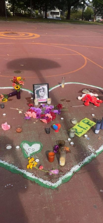 Friends%2C+loved+ones%2C+and+community+members+set+up+a+memorial+for+Erika+Evans+on+the+basketball+court+where+the+shooting+occurred.+