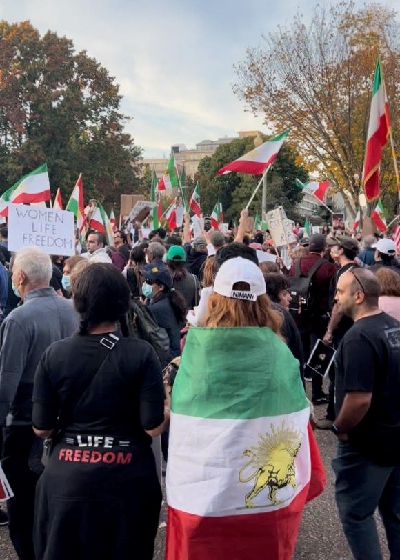 Protesters+in+Washington+D.C.+wave+and+wear+pre-Islamic+Republic+Iranian+flags+as+they+chant+%E2%80%9CWoman%2C+Life%2C+Freedom%E2%80%9D+in+Farsi+and+Kurdish+on+Oct.+22.+Global+protests+have+been+taking+place+in+major+cities+every+Saturday+since+Oct.+1+in+order+to+show+solidarity+with+the+people+in+Iran.