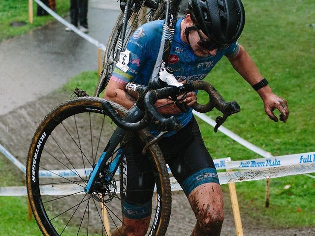 Dan English runs while carrying his bike in the Rochester Cyclocross race in September.