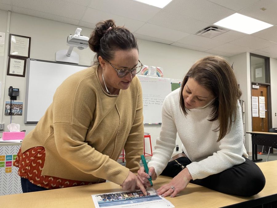 Art teacher Katy Mangrich and journalism adviser Debra Klevens analyze the “Survivor” competitors together. Mangrich won the competition a couple times in the past by picking the correct contestant that she believed would win. “[Winning] was exciting. I’ve picked a couple people for Klevens when she was not available for pick day, and she’s won on my picks too. I’d say I’m pretty good at making picks, whether it’s luck or whether I have good intuition,” Mangrich said.
