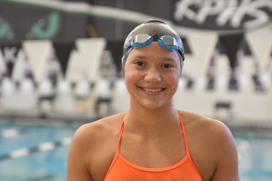 Freshman+swimmer+Elena+Amos+has+already+made+an+impact+on+the+swim+team%2C+breaking+the+school+record+in+the+50+free+and+the+100+fly.+She+also+swims+for+Blue+Tide+Aquatics+and+hopes+to+someday+represent+El+Salvador+in+the+Olympic+Games.