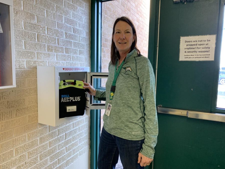 Nurse Jacque Revello stands next to an AED, one of two in the MSHS. Automated External Defibrillators are used to revive a patient during sudden cardiac arrest. 
