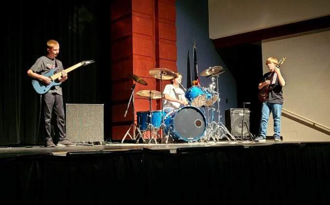 Dylan Craft, Henry English and Ryan Phillips play at the 2022 Hayes High School Talent Show. Their band is named The Idle Mind.