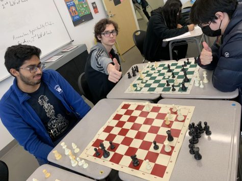 A Chess Club meeting underway as people enjoy the game.