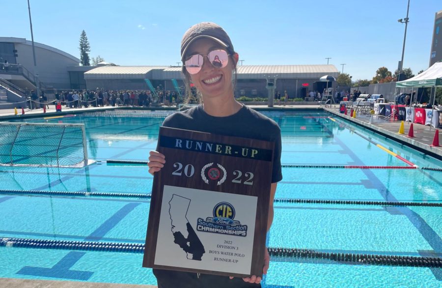 Orange County boys water polo coach of the year Kate Avery holds up her CIF Division 3 runner-up plaque. 