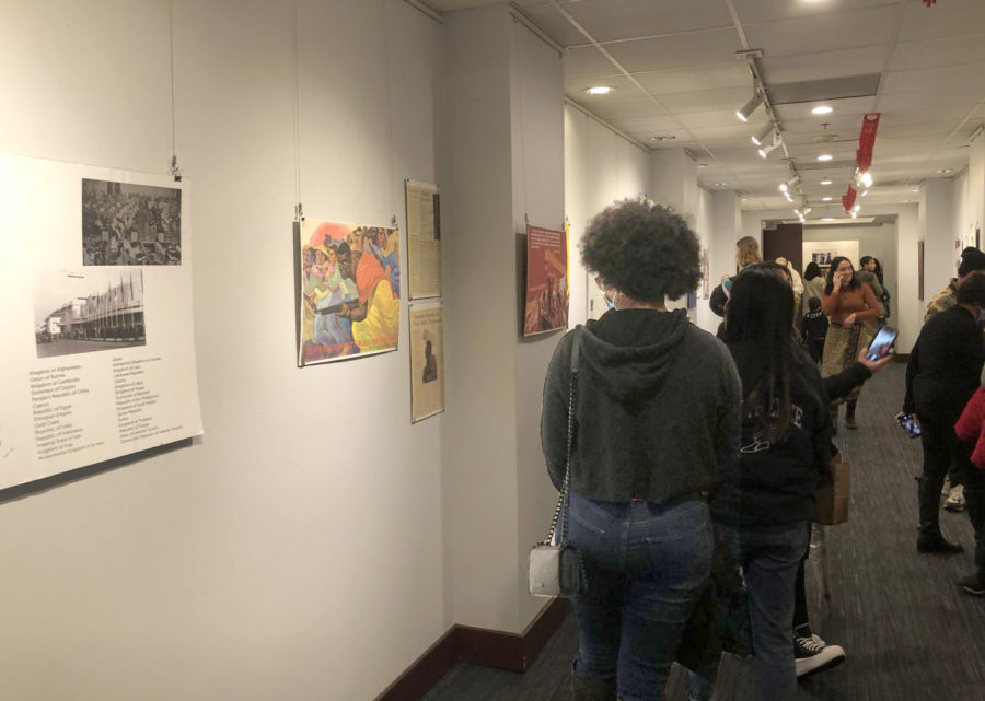 Attendees of the event observe and explore the historical art gallery at the OACC.