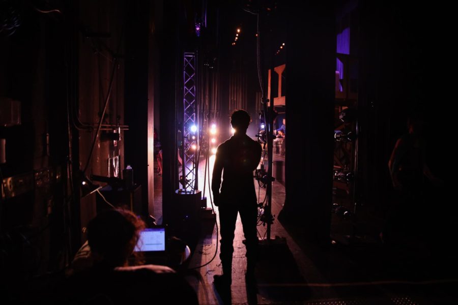 Theatre senior Mason Materdomini stands in the wings, waiting to go onstage during the theatre department’s in-school performance of the first act of “Pippin” on March 2. 
