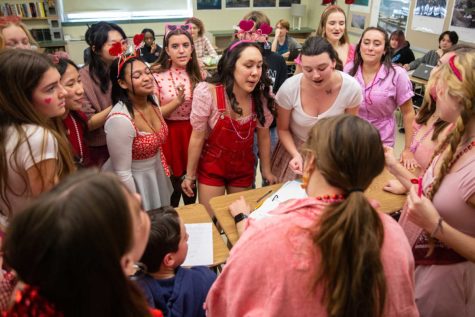 The Silvertones deliver a Singing Valentine during class on Feb. 14. The singers traveled through the school in two groups—girls and boys—to perform 266 times in one school day.