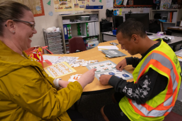 In a special education classroom, aids work with individual students and learn about the students’ abilities, areas of growth, and to help them in aspects where they need more assistance.