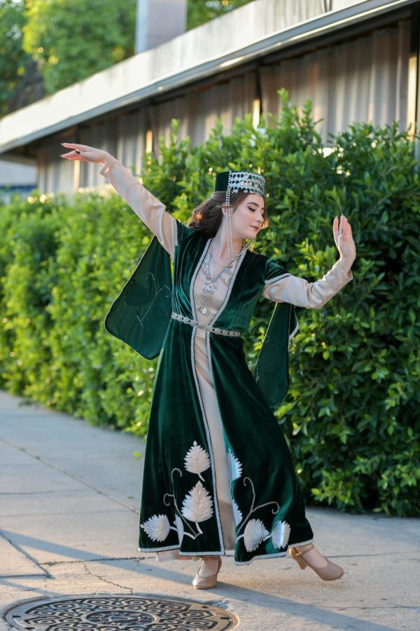 Junior Maggie Simonyan performs a cultural dance in her traditional Armenian clothing known as a Taraz. The Taraz and jewelery she wears originate from an Armenian region known as Artsakh, located in Southeastern Armenia. The Armenian national costume, having existed through long periods of historical development, was one of the signals of self-preservation for the Armenian culture. 