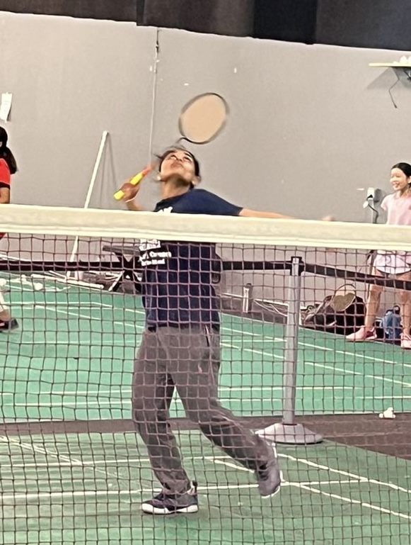 Freshman Srimayi Sriram aims to hit the shuttlecock during a practice game at Northern Virginia Badminton Club (NVBC).
