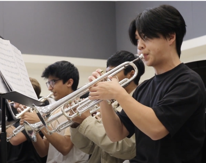 Trumpet player Brandon Yuan 23 rehearses with the Wind Ensemble. The Wind Ensemble is the top performing group in the Westwood Band program, who recently earned an invitation to perform at the prestigious Midwest Clinic in December 2023. 