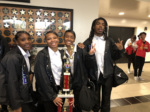 Juniors Tristen Banks, Kimora Jones, Nylah Thompson and Chris Williams smile with the trophy after winning the national Stage Breakers competition on April 15. Five teams competed for the championship. “Things that we [had] were [competitiveness], eagerness and determination, because the other teams who were here did good. To be able to beat other step teams, you need to [be the best in] precision, rhythm, and know how to put first things first,” Banks said. 